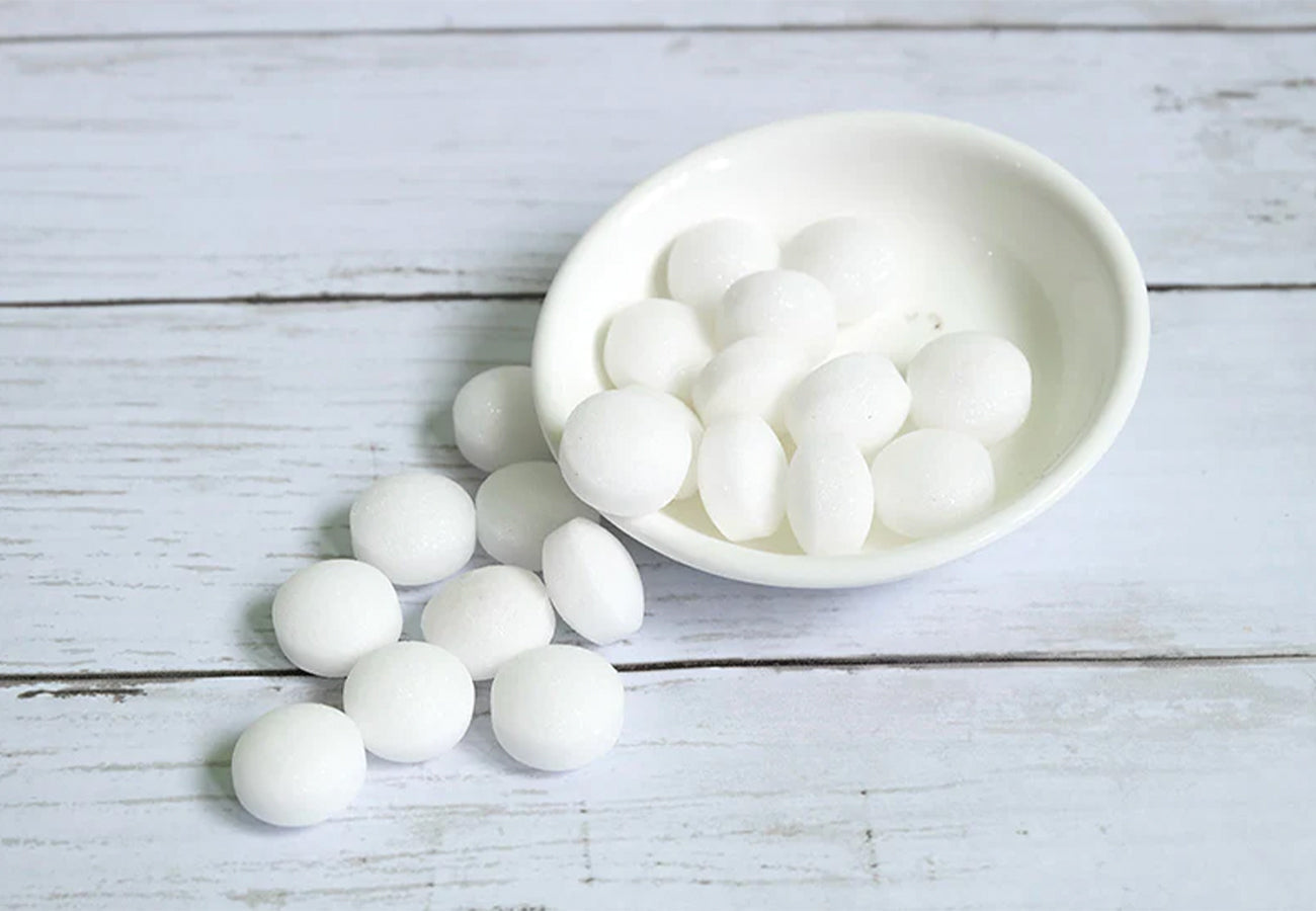 Small bowl of white mothballs